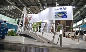 Макет первого в Челябинске вантового велопешеходного моста украшает стенд ПГ КОНАР на промышленной выставке «Иннопром» в Екатеринбурге